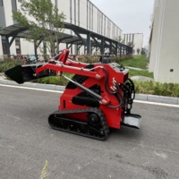 Chargeuse compacte sur chenilles avec godet basculant et godet tamis pour la rénovation des routes et trottoirs municipaux, garantie 1 an