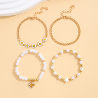Lot de 4 bracelets plaqués or avec breloque fleur marguerite, chaîne gourmette et bracelet extensible perlé – Coffret cadeau bijoux pour femme