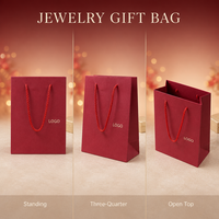 Sac cadeau en papier de luxe avec logo personnalisé et poignées en corde pour l'emballage de vente au détail en boutique