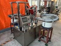 Machine de remplissage et de bouchage d'adhésif anaérobie