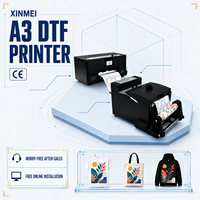 Mesin Printer DTF Ukuran A3 XINMEI untuk Pencetakan Tekstil Digital Kaos dengan Penggoyang Bubuk dan Pemasangan Online