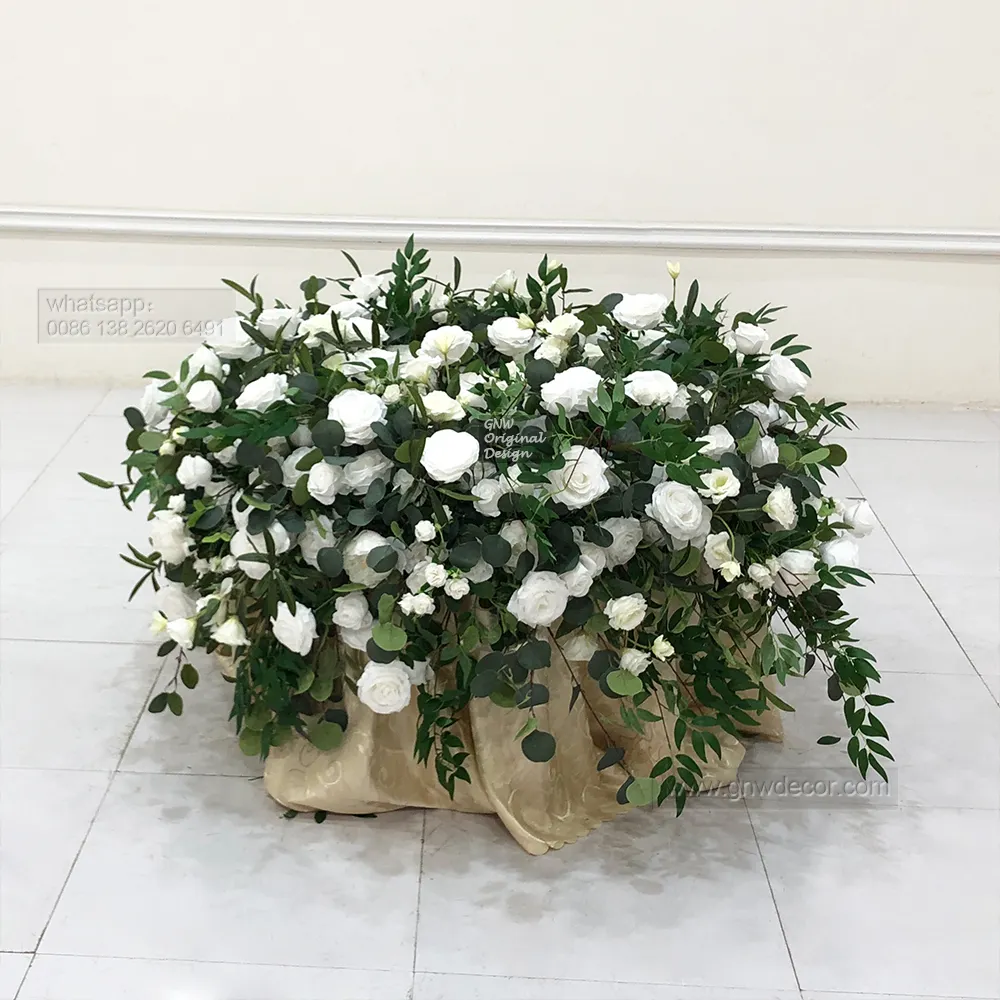 Elegant wedding artificial green white rose arrangement decorated foliage cake table florals