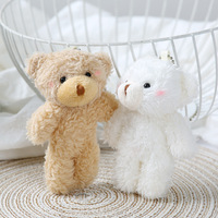 Ours en peluche à grosse tête, peluche courte et coton PP, emballage en sac en filet, accessoires de bouquet, pendentif