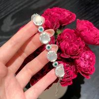 Bracelet élégant et luxueux pour femme, en cristal blanc ovale, motif floral, idéal pour mariage et soirée, qualité supérieure, directement de l'usine