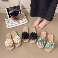 Nouvelles tendances de la mode estivale 2025 Sandales plates pour femmes avec un design floral inspiré d'un nœud Sandales de plage pour femmes en gros
