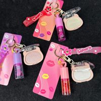 Porte-clés chaîne suspendu, Huile à lèvres hydratante, Gloss à lèvres, Ensemble de soin illuminateur avec Miel format voyage pour tous types de peau