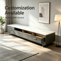 Meuble TV sur mesure avec plateau en marbre gris anthracite, tiroirs, poignées dorées, pieds en métal
