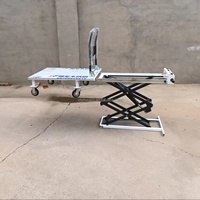 Chariot élévateur à ciseaux industriel électrique à quatre roues en acier inoxydable, plateforme élévatrice mobile portable OEM pour le chargement en entrepôt