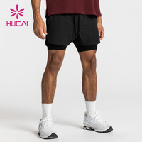 Shorts de compression d'entraînement pour hommes à double couche en nylon doublé avec logo personnalisé, shorts de sport avec poches