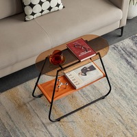 Table basse ovale moderne et durable à double plateau en verre avec structure métallique, design étroit et rangement ouvert pour salon et chambre à coucher