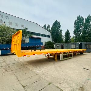 Directo de fábrica 12,5 metros <span class=keywords><strong>tres</strong></span> <span class=keywords><strong>ejes</strong></span> 12 neumáticos semirremolque de superficie plana remolques de camiones de acero Premium - Product Image 4