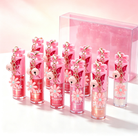 SIYPING Porte-clés Fleur Clochette Brillant à Lèvres Scintillant Hydratant Non Collant Maquillage Huile à Lèvres Brillante Portable pour la Beauté Quotidienne