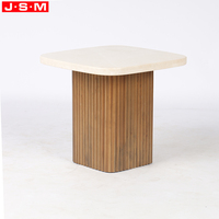 Table basse moderne haut de gamme en pierre naturelle avec base en bois gris clair pour salon