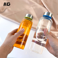 Bouteille en verre borosilicaté à haute teneur en borosilicate de cylindre transparent de 300ml 500ml 1000ml pour boire des bouteilles d'eau en verre réutilisables avec couvercles