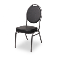 Chaise de banquet empilable en acier, dossier rond ovale, structure métallique foncée, assise rembourrée en tissu noir à pois, mobilier pour hôtels et salles.