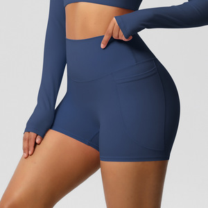 Shorts de ciclista de cintura alta para mujer al por mayor con bolsillo para teléfono, efecto melocotón, control de abdomen, transpirables, elásticos, para yoga y fitness OEM ODM - Product Image 4