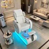 Fauteuil de pédicure matelassé blanc avec base incurvée à lumière LED et bassin transparent bleu pour spa des ongles