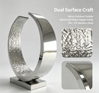 Sculpture circulaire abstraite moderne en acier inoxydable poli effet miroir traditionnel