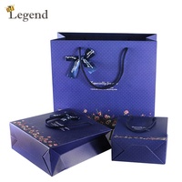 Sacs en papier cadeau floraux en gros avec nœud en ruban, sacs en papier personnalisés avec logo imprimé pour emballage de cadeaux de mariage et d'anniversaire