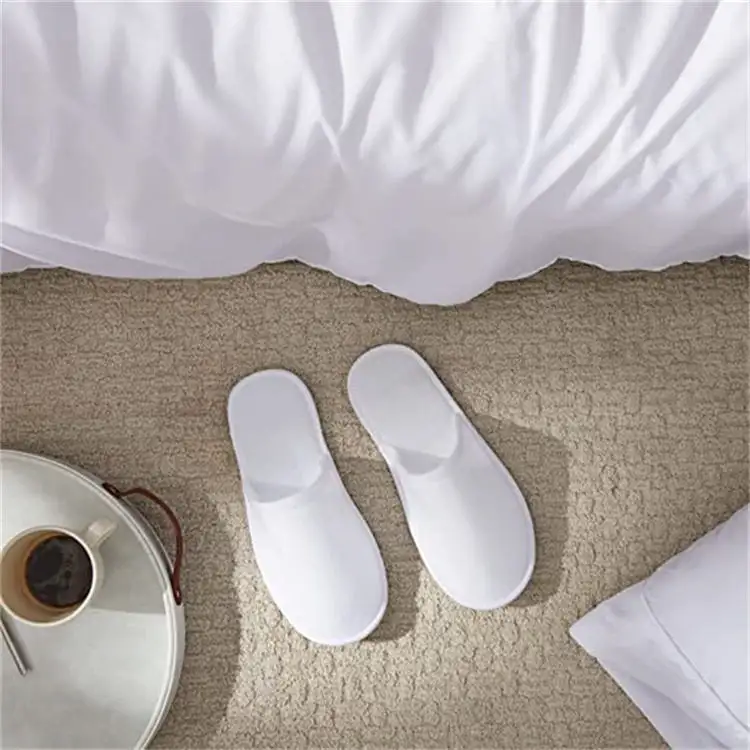 Wholesale high quality anti-slip unisex odorless fleece white eco friendly bulk guest disposable hotel slippers luxury for hotel