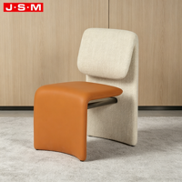 Chaise de salle à manger moderne et confortable en mousse moulée avec revêtement textile orange pour table à manger