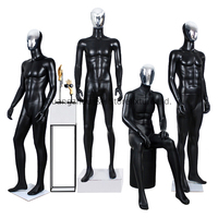 Mannequin masculin musclé en fibre de verre, corps entier noir mat, visage argenté chromé, pour présentation de costumes d'affaires
