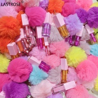 Prix d'usine Huile à lèvres Pom Key Chain, gloss hydratant pour enfants, avec pompon en fourrure mignon, saveur fruitée, 45 couleurs