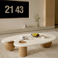 Table basse ovale en bois massif blanc nordique, finition brillante Wabi-Sabi, forme irrégulière, taille personnalisable, luxe avec trois pieds