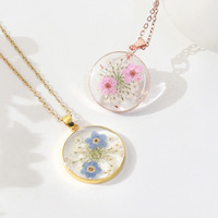 Bijoux de collier en acier inoxydable doré haut de gamme à la mode avec chaîne à maillons vraie fleur et pendentif en résine transparente de fleur séchée