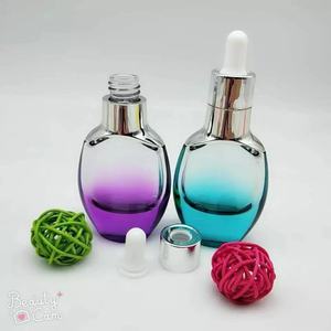 Precio de fábrica de fondo plano logotipo de la forma del cuerpo para azafrán botella de vidrio transparente francés - Product Image 2
