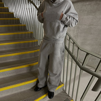 Ensemble survêtement homme personnalisé gris oversize avec sweat à capuche et pantalon de jogging 2 pièces en polyester respirant pour le streetwear décontracté et les loisirs