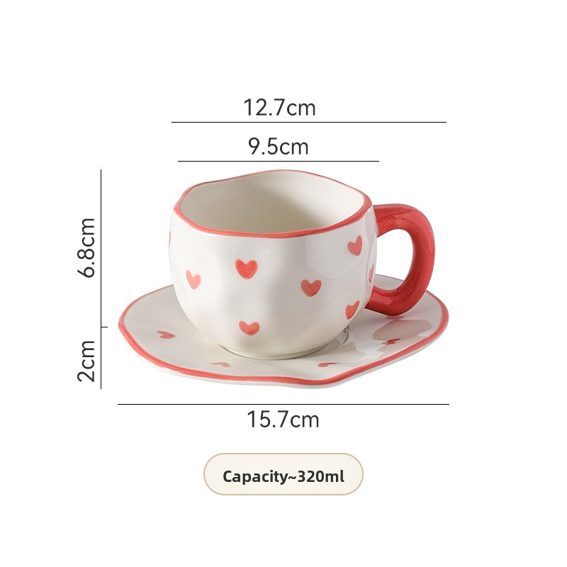 Tasse et soucoupe à fleurs blanches peintes à la main