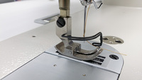 Machine à coudre industrielle à point noué à alimentation par aiguille haute vitesse à aiguille simple automatique JUKI DLN-9010A-SH du Japon avec table