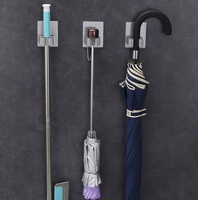 Vente en gros de porte-balai en acier inoxydable support mural pour balai et vadrouille à usage intensif auto-adhésif pour la maison