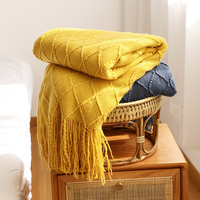 Vente en gros de canapé adulte confortable de voyage respirant en acrylique solide couverture tricotée légère personnalisée avec glands