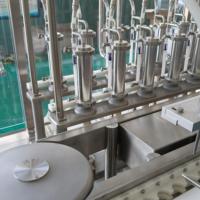 Machine de remplissage par pulvérisation pour bouteille de 100 ml, ligne de production entièrement automatique