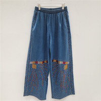 Novedad 2026: Conjuntos de mujer de talla grande de alta gama con camisa vaquera de manga larga con pedrería termoadhesiva y pantalón de pierna ancha con patchwork, al por mayor.