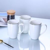 Fournisseur de tasses à sublimation personnalisées pour eau et lait, tasse à café en céramique blanche à sublimation avec bord noir