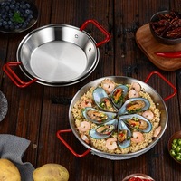 Wajan datar stainless steel gaya Korea dengan pegangan merah, cocok untuk memasak ramen instan, makanan laut, dan hidangan pesta.