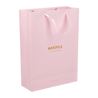 Sac à provisions en papier imprimé rose de boutique avec poignées en ruban emballage de vêtements sacs en papier avec logo personnalisé