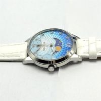 Montre en acier inoxydable pour femme, cadran bleu lune, bracelet en cuir blanc, quartz, étanche, design haut de gamme, élégance classique, vente en gros