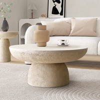 Tables basses rondes en béton d'inspiration naturelle, finition texturée sable Table d'appoint centrale pour un usage quotidien