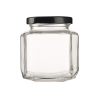 Sonderform Sechseck 180ml 6,0 Unzen Honig Oval Hex Erdnuss butter Marmelade Honig glas Gläser mit Schwarz gold Metallic Deckel
