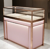 Comptoir de présentation de bijoux GZowin de luxe rose or personnalisable avec éclairage LED, vitrine de vente au détail durable et de haute qualité pour bijoux