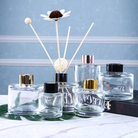 Vente en gros Bouteille vide en verre de diffuseur de parfum de forme ronde de couleur personnalisée transparente de 100ml 150ml 200ml avec couvercle