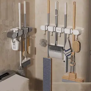 Gran Venta de clip para fregona, colgante de pared, sin perforación, escoba, gancho para fregona, estante fijo, puerta de baño, estante de almacenamiento trasero, artefacto