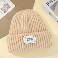 Bonnet en tricot côtelé uni avec étiquette tissée, chaud pour l'hiver, à revers, unisexe, logo personnalisé, vente en gros, motif 100% personnalisable