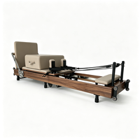 Vente en gros de Reformer Pilates pliable haut de gamme, machine de fitness pour salle de sport, Reformer Pilates pliable en bois de noyer pour studio
