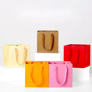 사용자 정의 인쇄 종이 가방 로고 쇼핑 의류 핑크 리본 핸들 제조 업체 크래프트 종이 가방