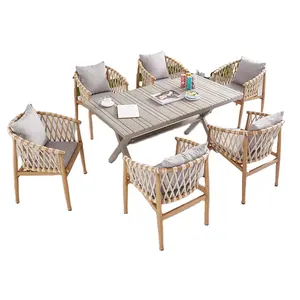 Resort garden plastic wood dining table chair telescopic long table rattan chair set terrace 7 pieces of furniture